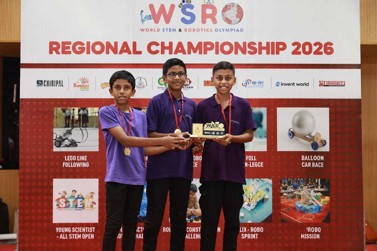 YuvaCoders students holding the WSRO 2026 championship trophy